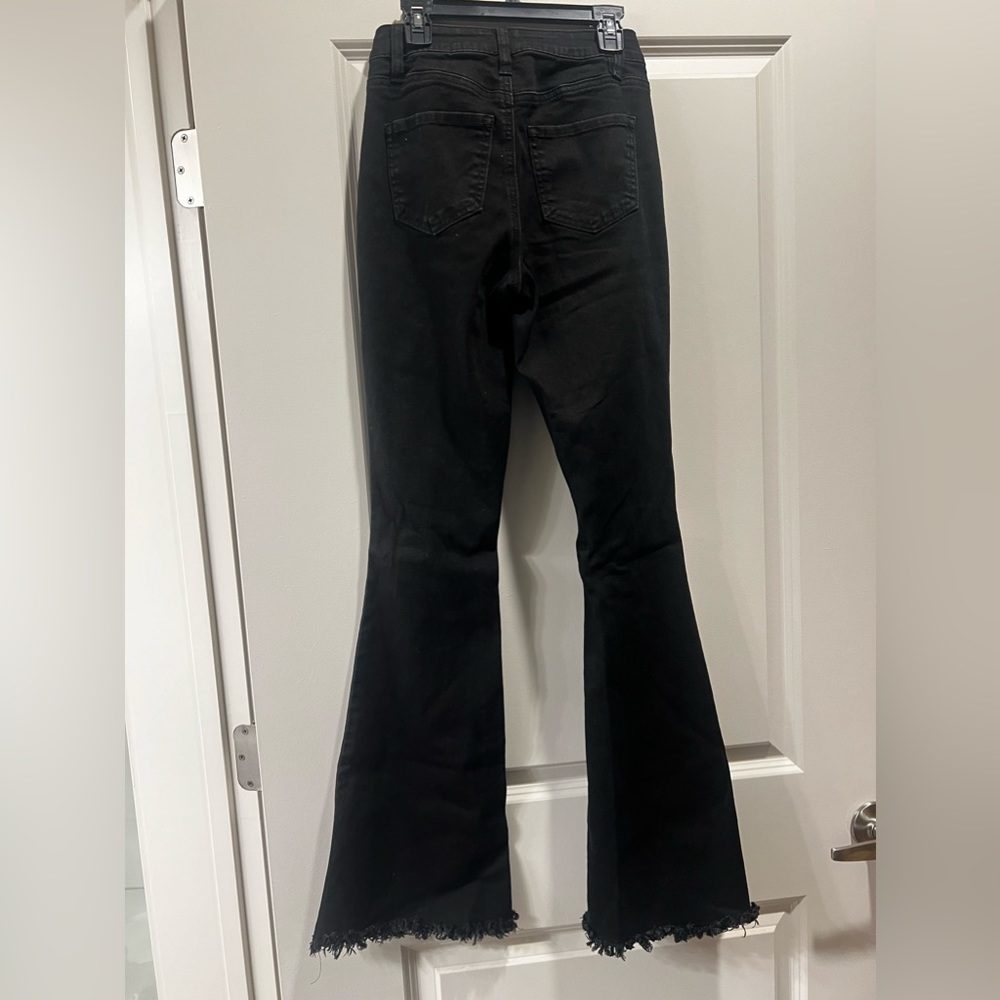 Black Flare jeans with holes at the knees